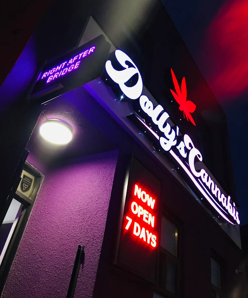Dolly's Cannabis neon sign at night — 1105 Bathurst Street, Toronto